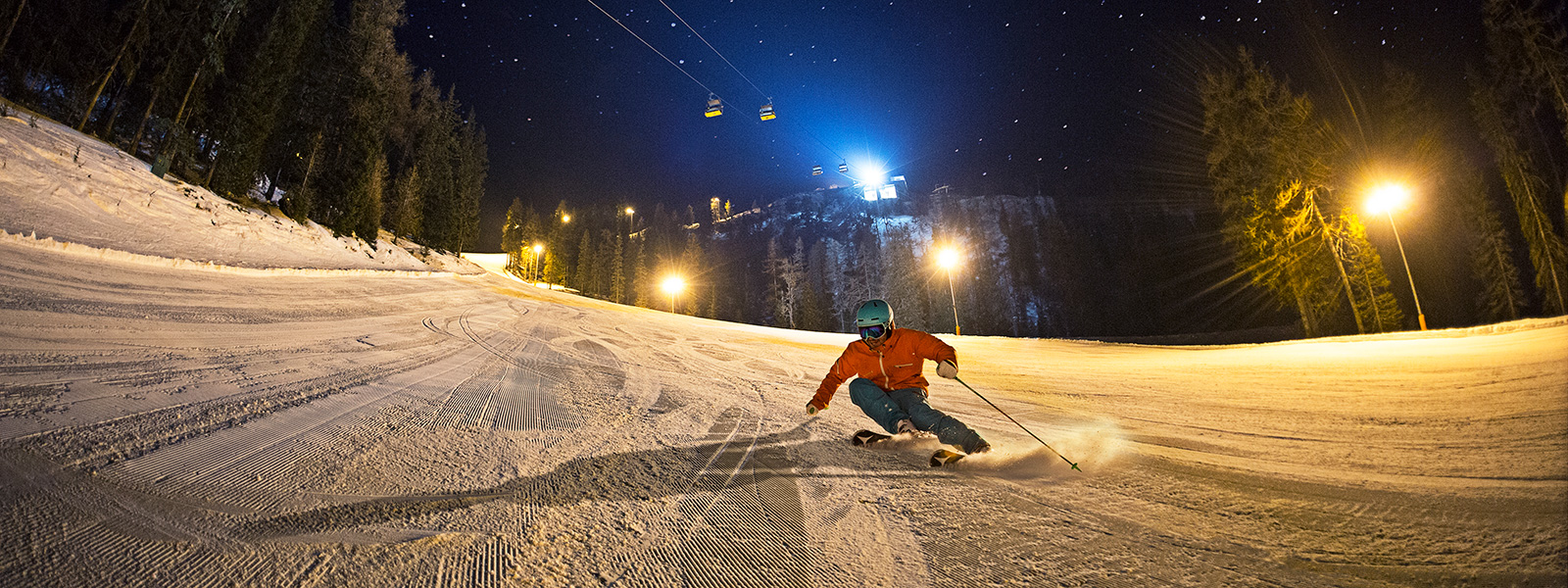 Perfectly groomed piste during night skiing on the Hochwurzen